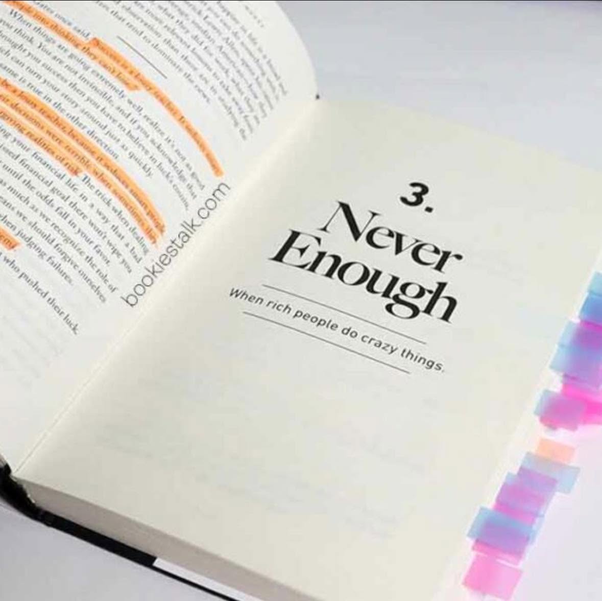 《致富心態》書中 Never Enough 章節，頁面有梁文宣做的橘色畫線